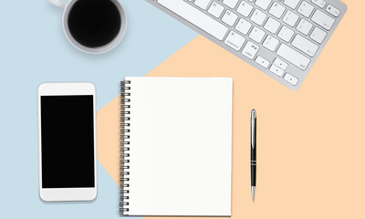 Directly above view of office desk with computer keyboard, cup of coffee,smart phone, note pad and pen on dual tones background