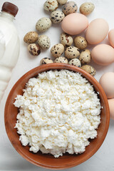Natural farm products. Chicken and quail eggs, bottle and glass of cow's milk