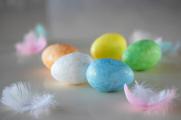 Easter concept. Colorful decorative eggs on a light background.