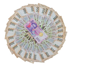 Circle of ukrainian money - 500 banknotes hryvnia and two stacks  of 100  banknotes (bill ) and coin isolated  on white background with free space for  text. Money concept. Flat lay, top view