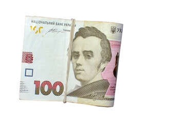 A pile of ukrainian money on a 100 hryvnia isolated isolated on white background. UAH. Free copy space. Business and finance concept. Top view