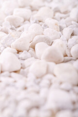 Fototapeta na wymiar White decorative rocks and pebbles