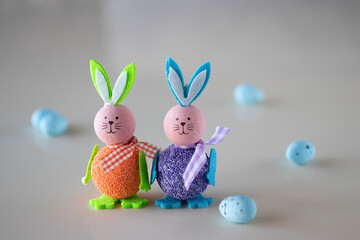 Easter concept. Two decorative eggs and two decorative rabbits.
