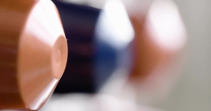 Coffee capsules on ramp ramp in Tracking Shot with blurred background