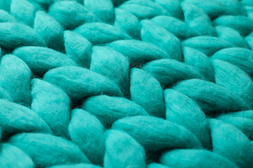 Turquoise knitted wool texture as background, closeup