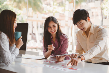 Creative ux ui designers designing screens for mobile responsive website development with UI/UX....