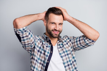 Photo portrait of confident smiling guy looking handsome demonstrating haircut isolated on grey color background