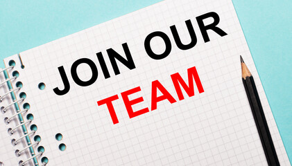 On a light blue background, a checkered notebook with the words JOIN OUR TEAM and a black pencil.