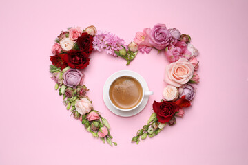 Obraz na płótnie Canvas Beautiful heart shaped floral composition with cup of coffee on pink background, flat lay