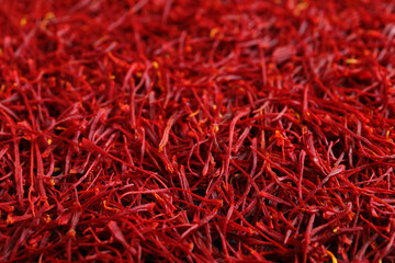 Fototapeta premium Aromatic dried saffron as background, closeup view