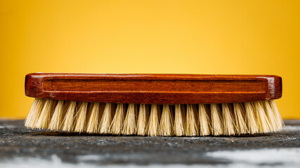 Accessories for the care and cleaning of shoes on a wooden table