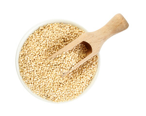 Bowl with quinoa and wooden scoop on white background, top view