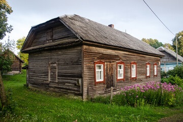 Interesting old wooden house and windows in Veslabada, Latvia