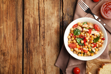 Delicious fresh chickpea salad served on wooden table