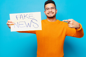 young hispanic man happy expression fake news concept