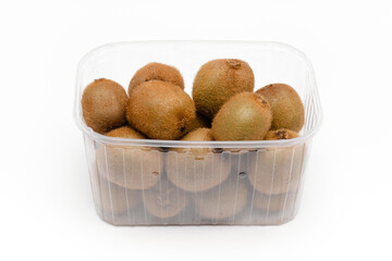 kiwi fruit in a plastic basket on a white background
