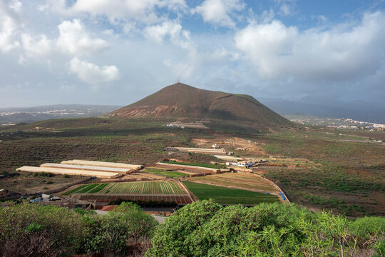 Rural views of the agricultural lands and small villages surrounding Montana Gorda, small volcanic peak nearby Charco del Pino, part of Granadilla de Abona municipality Tenerife, Canary Islands, Spain