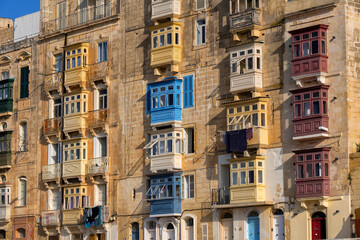 Fototapeta na wymiar Traditional Maltese Houses With Balconies In Valletta, Malta