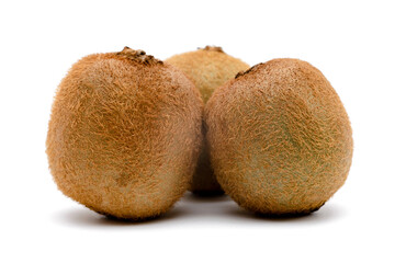 three kiwi fruit on a white background