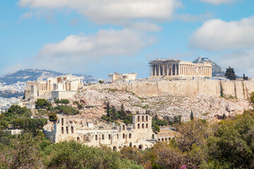 Fototapeta na wymiar Parthenon view from Filopappou Hill. There can be seen the facade and the southern side of the Parthenon temple, of 5th century BC, on the sacred Akropolis Hill, in Athens, Greece, Europe