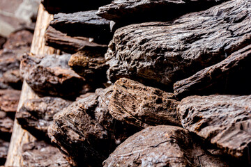Dry charcoal pile stacked in basement