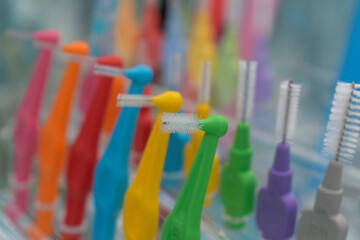 Interdental brushs for cleaning dental interspace. Interdental brushs are multicolor. Selective focus.
