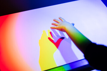 Prism rainbow light and shadow of a hand