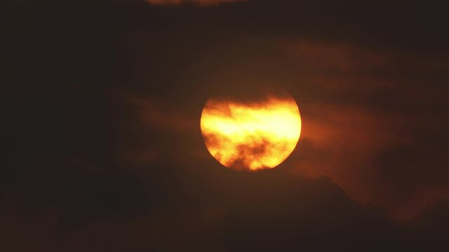 Time Lapse, Abstract Sunset With A Huge Sunball, Through Clouds