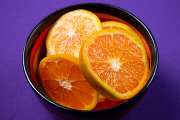 orange on a black plate