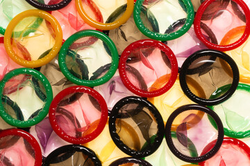 Colorful condoms background.