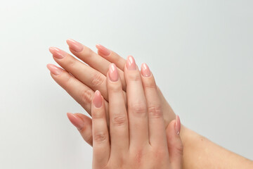 Women's hands with a fresh manicure.