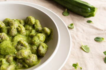Homemade gnocchi with zucchini cream, typical Italian food