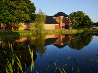 Fototapeta na wymiar Farm mansion house by a lake in Denmark