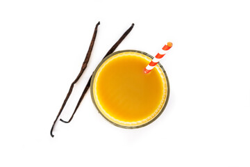 Delicious vanilla milkshake in glass isolated on white background. Top view