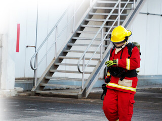 firefighter training., fireman using water and extinguisher to fighting with fire flame in an emergency situation