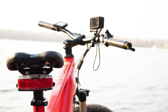 Ukraine Dnipro 30.03.2021 - Xiaomi HIMO C26 electric bike with camera pro 9 on the handlebars in the forest in spring, eco