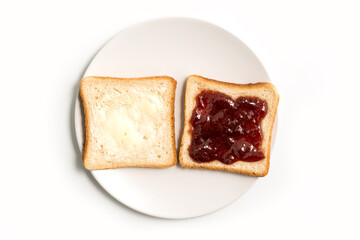 Butter and Jam or Jelly sandwich in a white plate on a white background - top view
