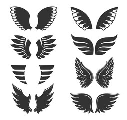 Set of hand drawn bird or angel wings of different shape in open position. Contoured doodle wings set