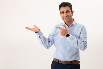 AN ADULT MAN POINTING TOWARDS OTHER HAND DISPLAYING PRODUCT	