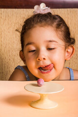 Child looking at mini chocolate egg.