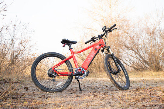 Ukraine Dnipro 30.03.2021 - Xiaomi HIMO C26 electric bike with camera pro 9 on the handlebars in the forest in spring, eco