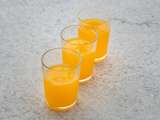 Fresh orange juice in a glass is ready to serve for breakfast.