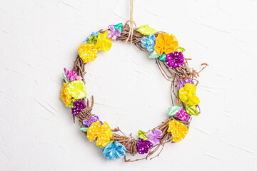 Braided wreath on white putty texture wall