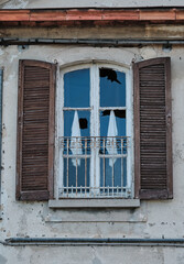 Fototapeta na wymiar broken glass industrial window decay abandoned buildings.
