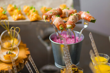Catering service. Table with snacks food at event.