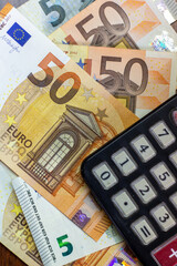 50 Euro bills with a calculator