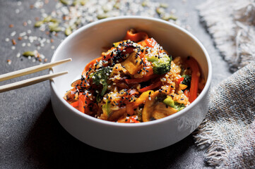 Japanese rice salad with sesame seeds, chicken and vegetables.