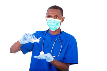 portrait of a young doctor using a disinfectant.