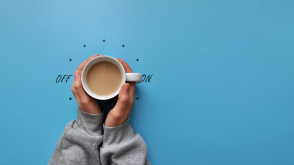 A cup of coffee in hand and a light switch. The symbol of the beginning of the day. Turn on good...