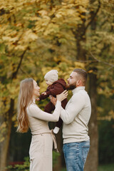 Fototapeta premium Family with little daughter in a autumn park